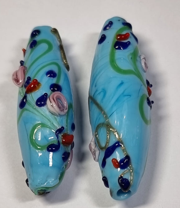 45-47x15MM H/MADE LAMPWORK BEADS - LARGE RICE - BLUE/FLORAL