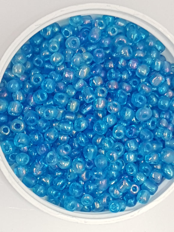 6/0 CHINESE ROUND SEED BEADS - TRANS. RAINBOW - DARK TURQUOISE