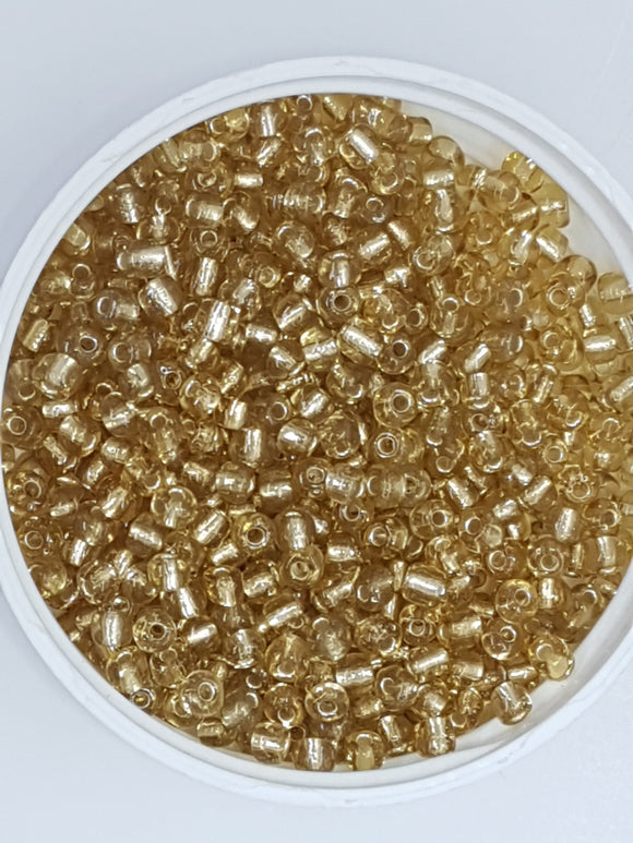 6/0 CHINESE SEED BEADS - TRANSPARENT - GOLDEN