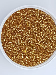 8/0 CHINESE GLASS SEED BEADS - TRANSPARENT GOLDEN