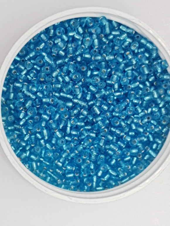 8/0 CHINESE GLASS SEED BEADS - TRANSPARENT LIGHT BLUE