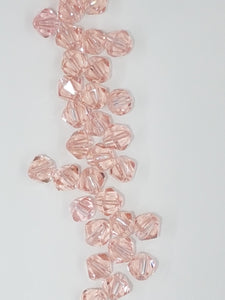 BICONES - 6MM GLASS FACETED BICONES - PINK
